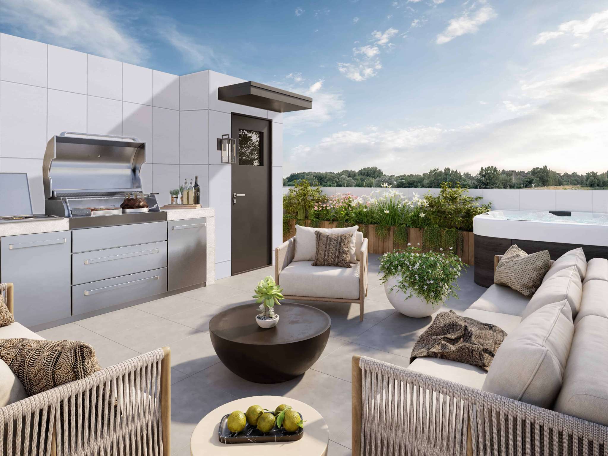 Eden Townhomes – A rooftop terrace with a built-in stainless steel BBQ kitchen, outdoor seating with cushions, a hot tub, and planters with greenery.