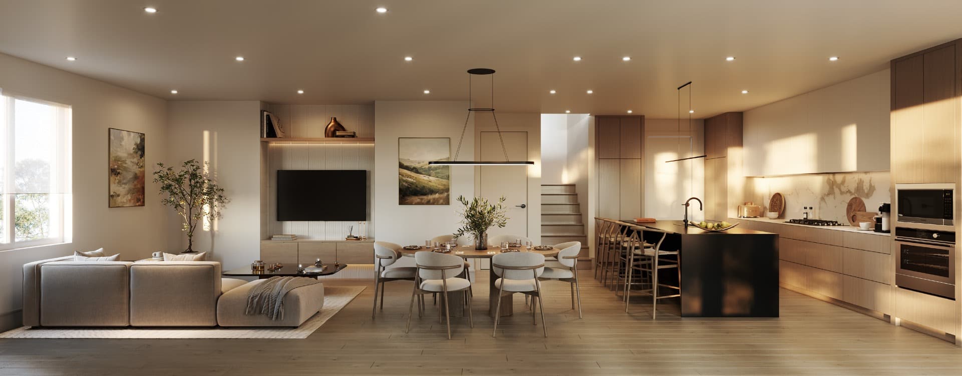 Katsura – A wide-angle rendering of an open-concept living, dining, and kitchen space bathed in soft, warm daylight. The interior features light hardwood flooring, a low-profile sectional sofa, a round wooden dining table, and a kitchen with light wood cabinetry, integrated appliances, and a contrasting black island.