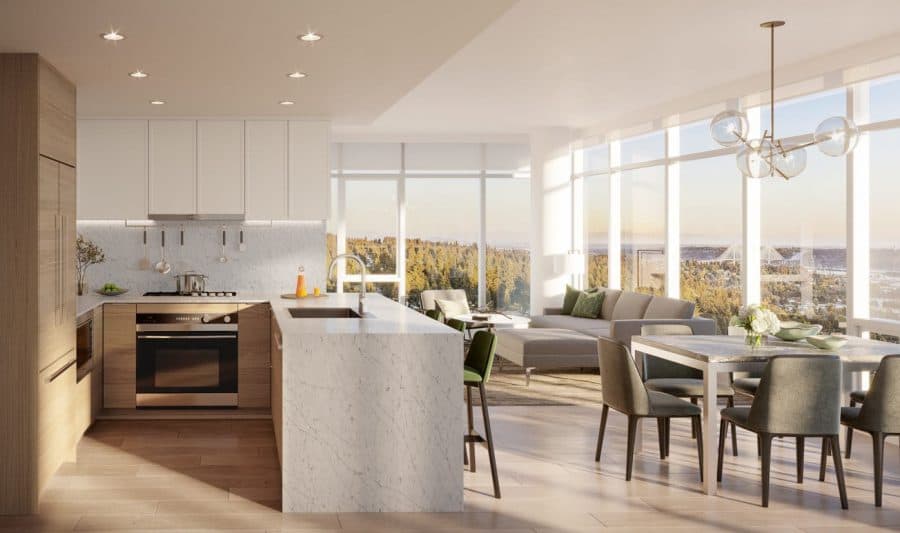The Heights on Austin – Kitchen with a large marble island, stainless steel oven, and wood cabinetry, open to a dining area and floor-to-ceiling windows with a treed view.