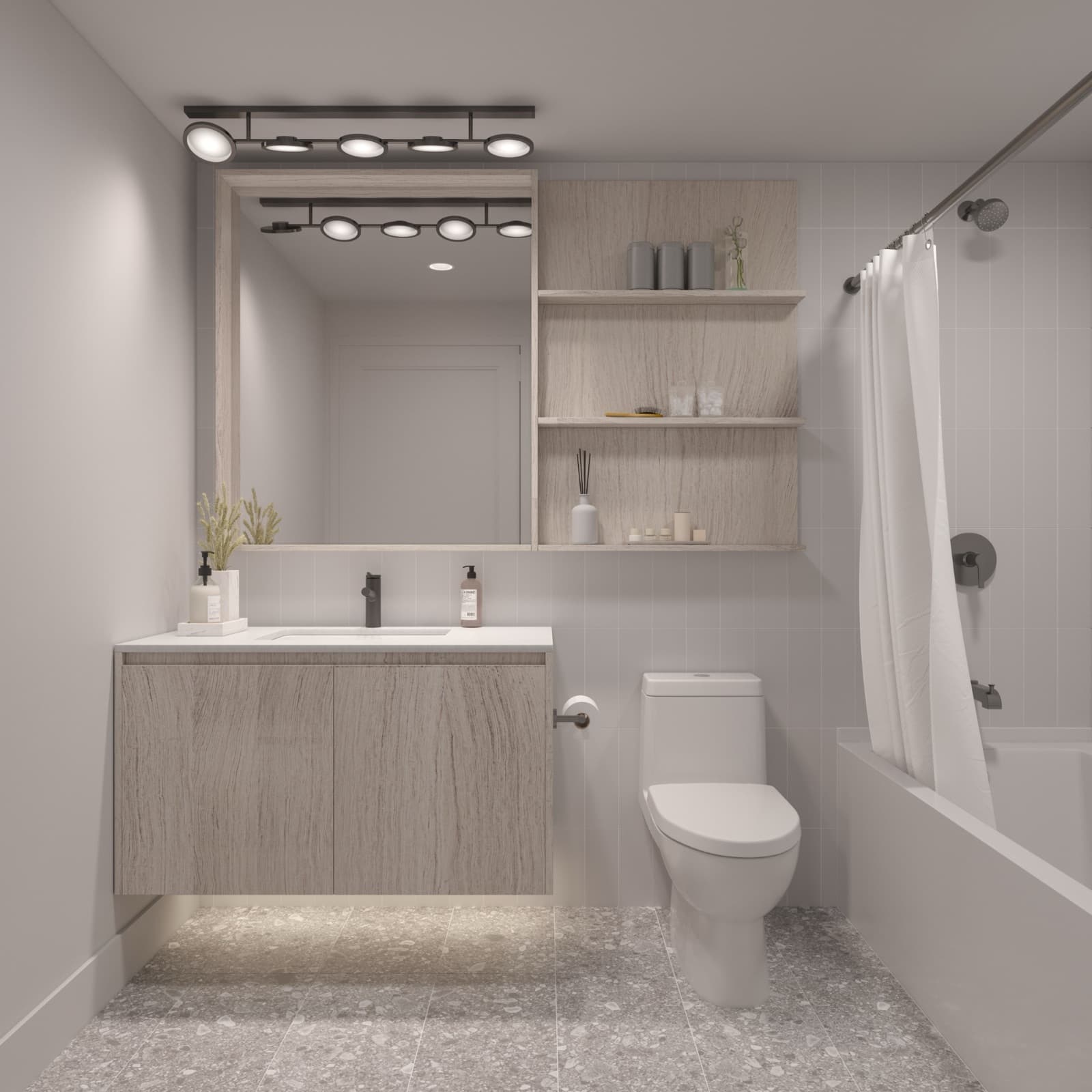 Umbra at Portwood – A modern bathroom with a light-wood floating vanity, large wall mirror with light fixture, toilet, and bathtub with curtain.