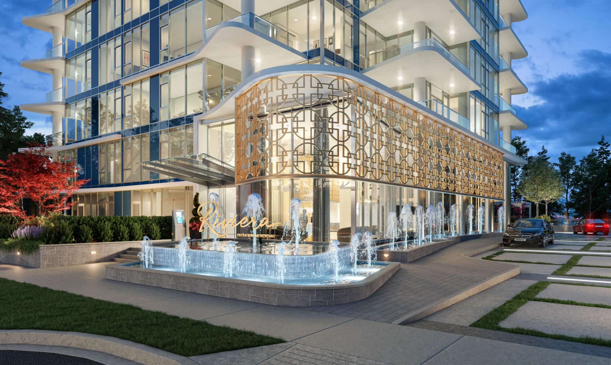 Riviera – Dusk rendering of the tower base and arrival court with illuminated fountains, a gold lattice screen over the glass lobby, and Riviera signage.
