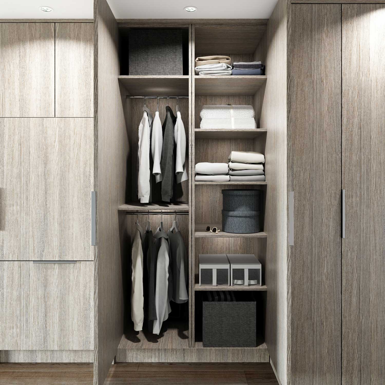 Sitka House – Walk-in closet with hanging clothes on rods and folded linens and storage boxes on open wood shelving.