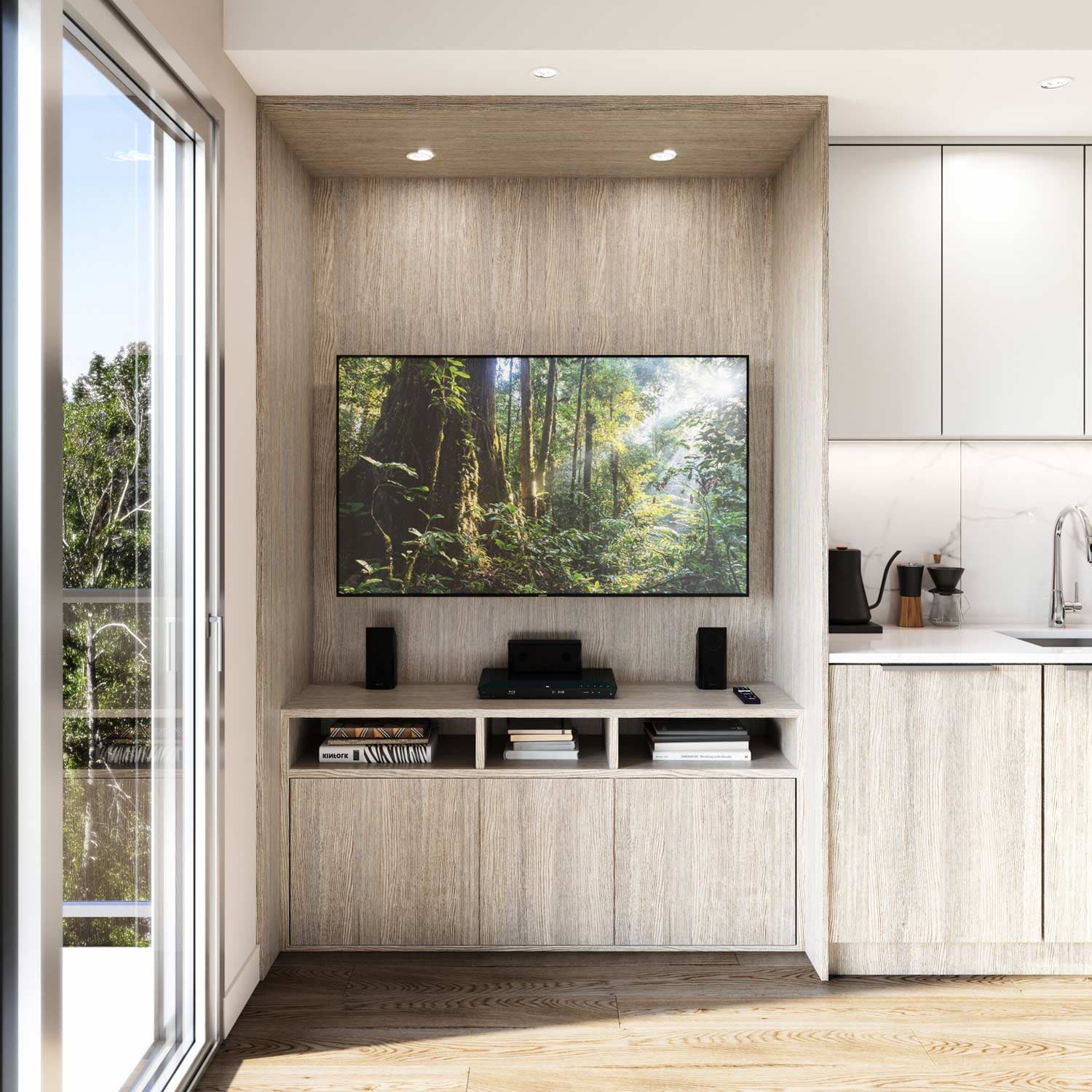 Sitka House – Built-in wall-mounted TV media unit with wood cabinetry and open shelving for books, next to the kitchen.