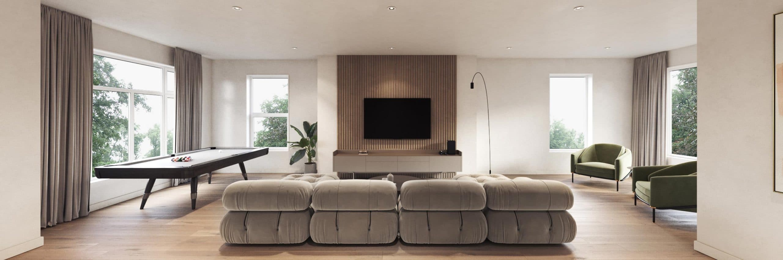 Elisa at Sunnyside Park – Full view of a shared pool table and media lounge room with a tufted sofa and green armchairs.