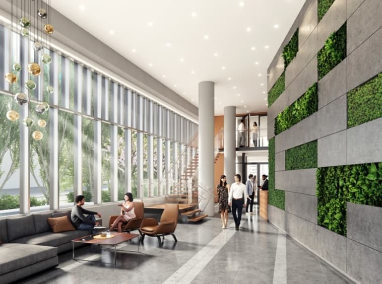 Ascent – Building lobby rendering with a living green wall, lounge seating, staircase, and floor-to-ceiling windows.