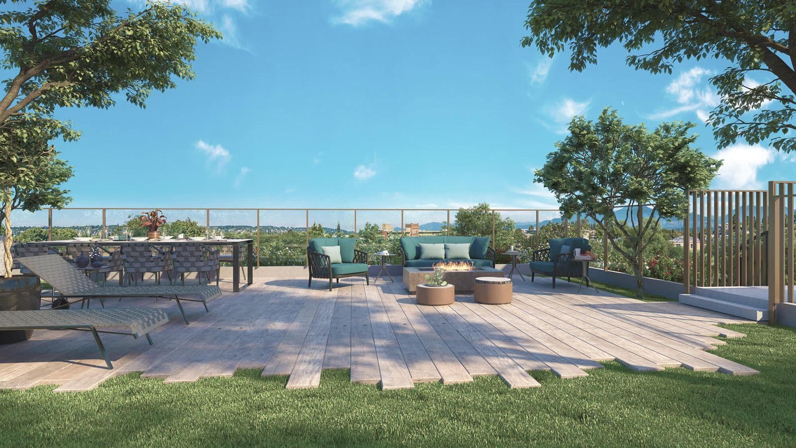 The Arbutus – Rooftop terrace with a wood deck, teal outdoor furniture around a fire table, a dining set, loungers, and a tree-lined lawn under a blue sky.