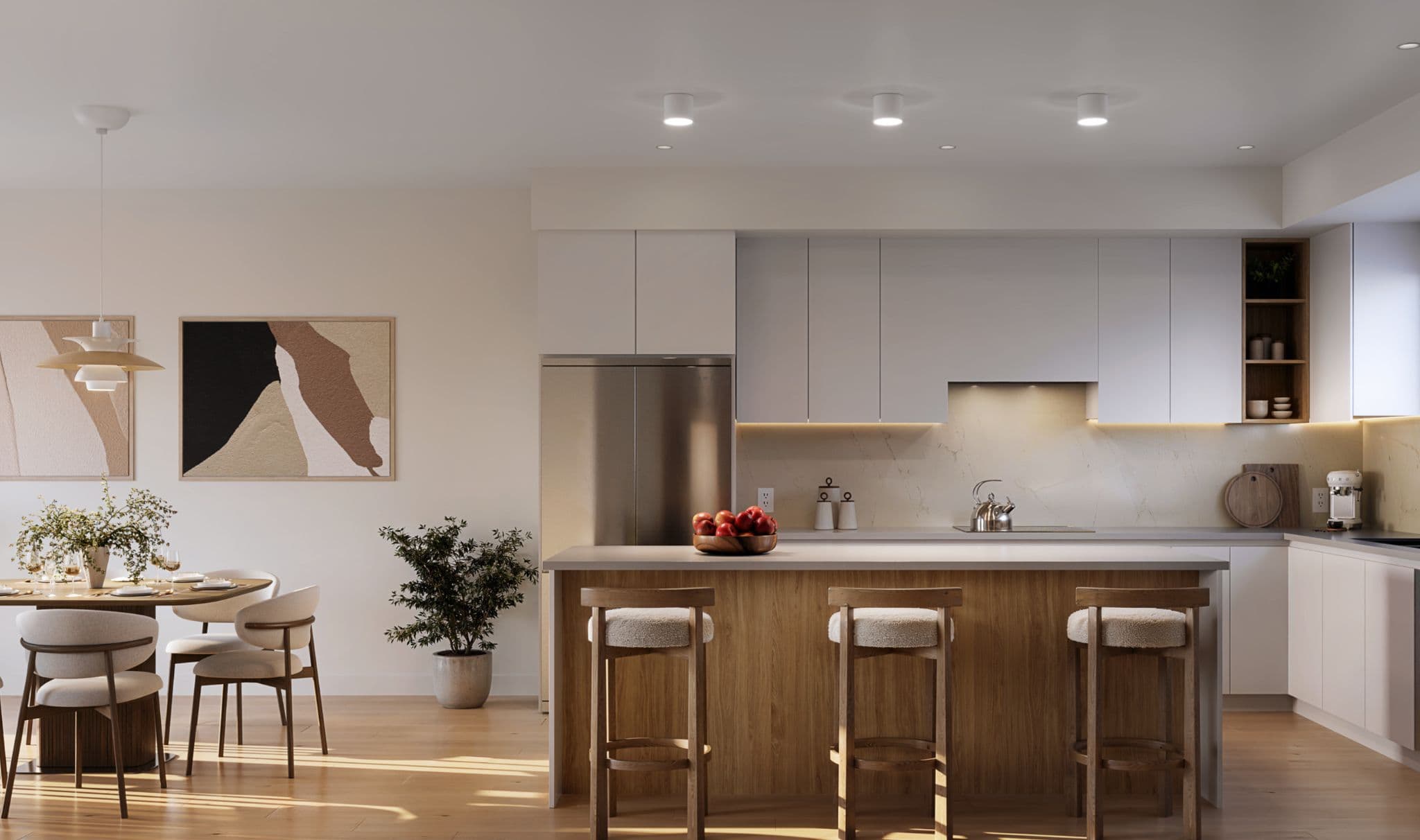 Rocklin – Open-concept kitchen and dining area with a wood-toned island, white cabinetry, stainless fridge, pendant lighting, and a round dining table.