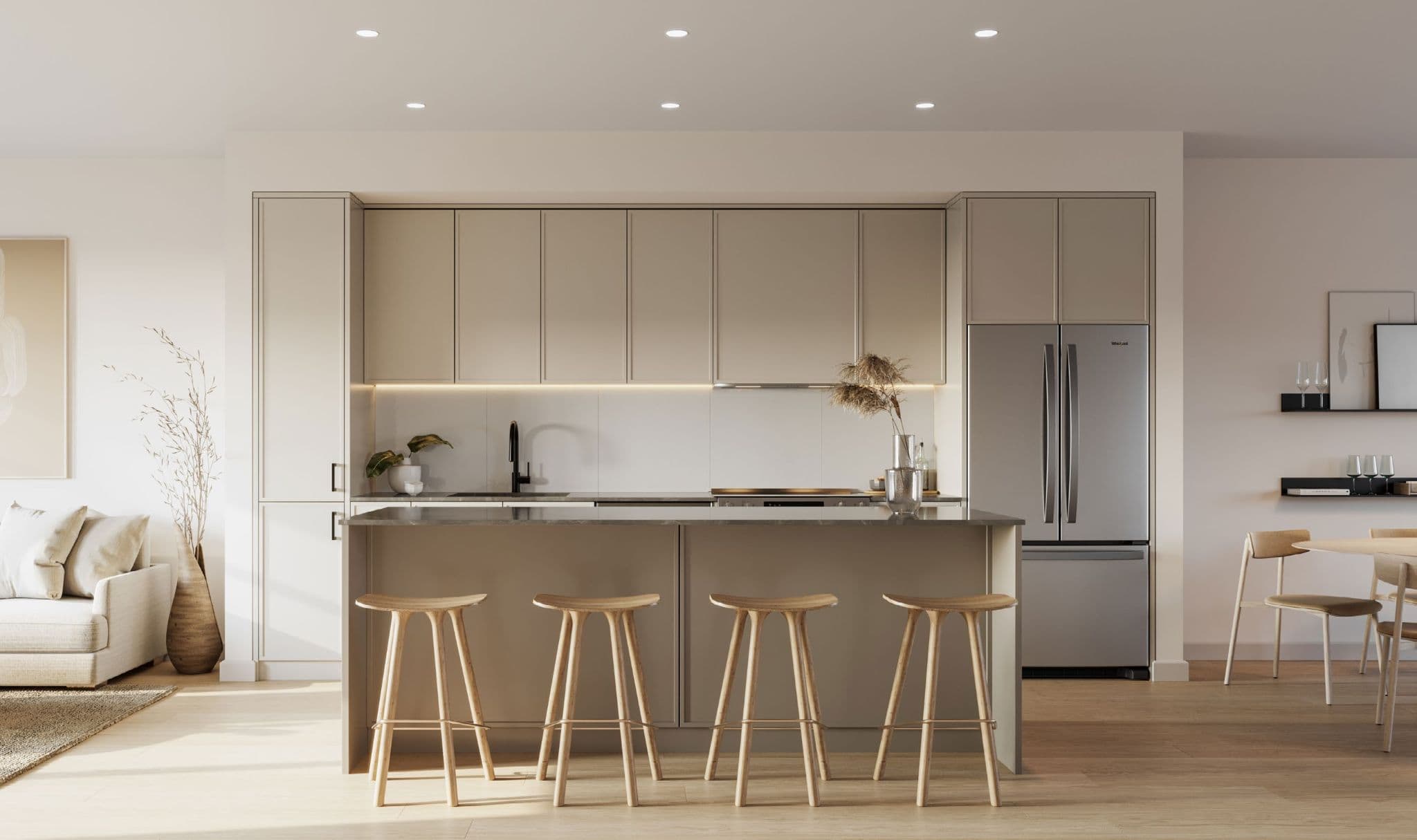 Westview Townhomes – A modern open-concept kitchen featuring seamless warm taupe cabinetry with integrated under-cabinet lighting, stainless steel appliances, and a central island lined with four wooden barstools. Pale wood floors and soft natural sunlight create a bright, serene, and minimalist aesthetic connecting the space to adjacent living and dining areas.
