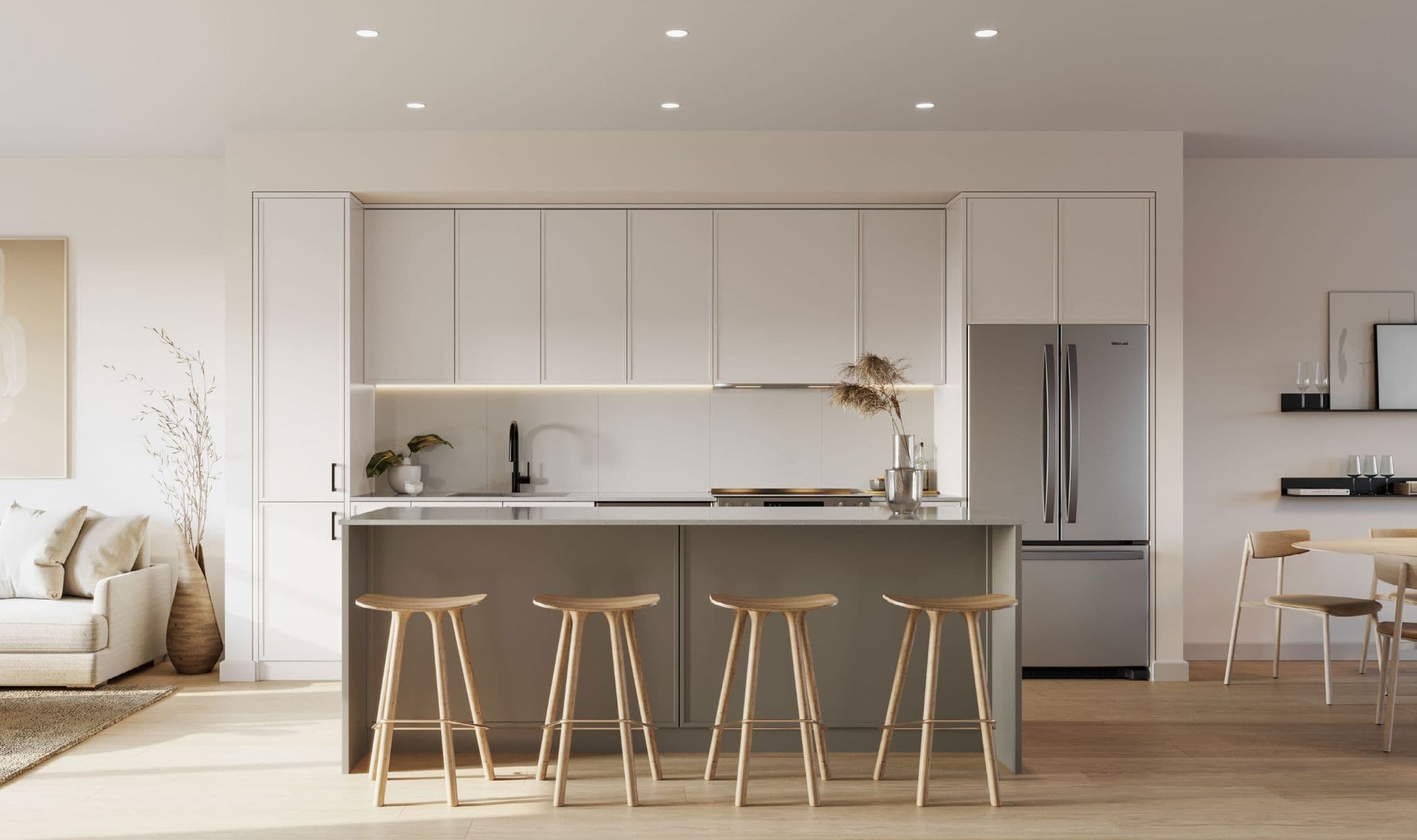 Westview Townhomes – A modern, minimalist kitchen showcasing off-white upper cabinetry, integrated stainless steel appliances, and a central grey island with four natural wood barstools. Warm daylight brightens the open-concept space, revealing light hardwood flooring and glimpses of an adjoining living and dining area.