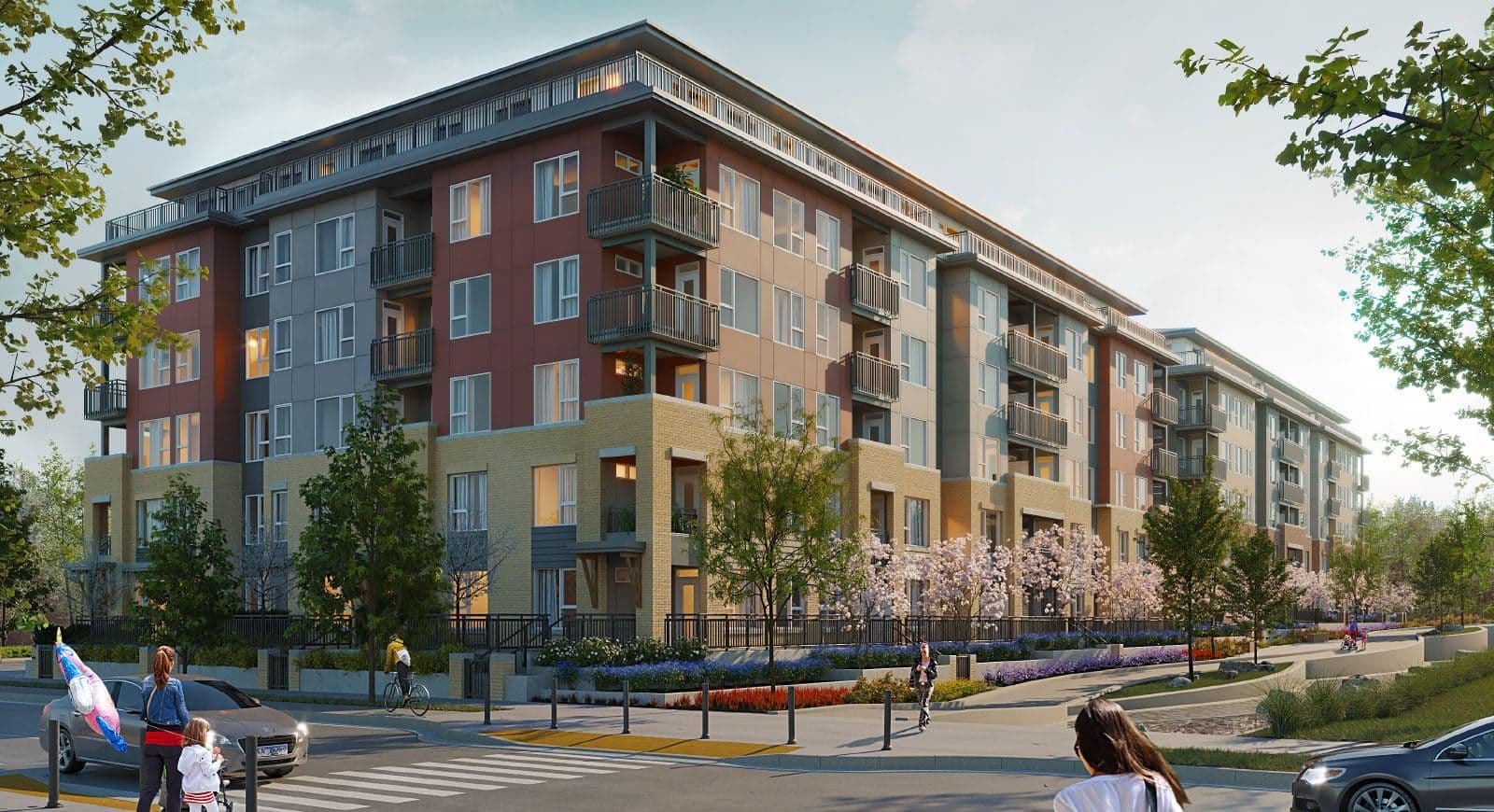 Ashton – A street-level rendering of a mid-rise apartment building with red, tan, and grey panel cladding, balconies, and flowering trees along the sidewalk.