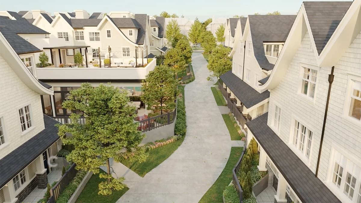 The Robinsons Parkside Collection – Overhead view looking down a landscaped courtyard walkway between rows of shingle-style townhomes, showing rooftop patios, a pool deck, and mature trees.