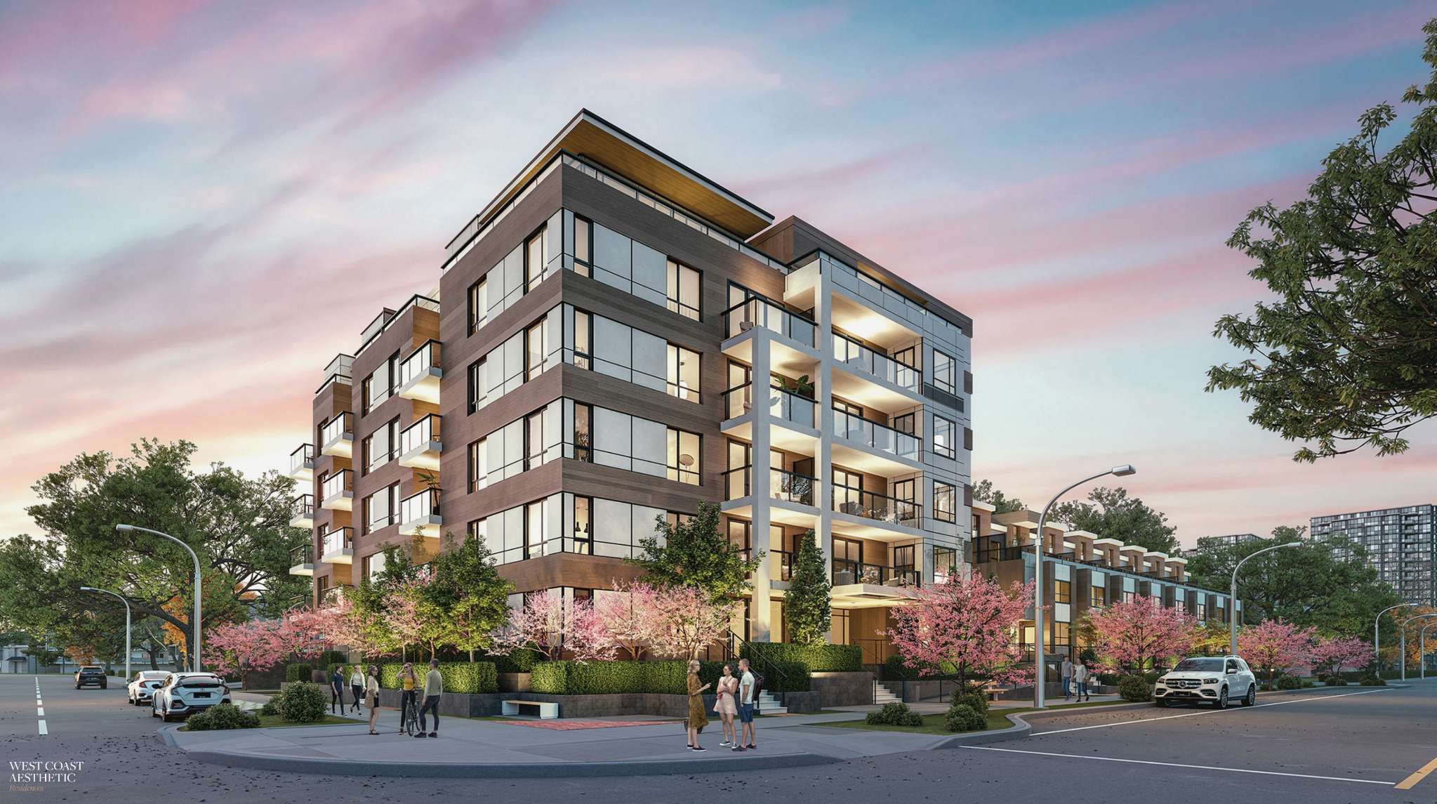 Luxio on the Park – A corner street-level view of a modern six-story residential building with wood-tone panelling, glass balconies, and warm interior lighting under a soft pink dusk sky. Blooming cherry blossom trees, landscaped hedges, and pedestrians line the sidewalk in front of the contemporary development.