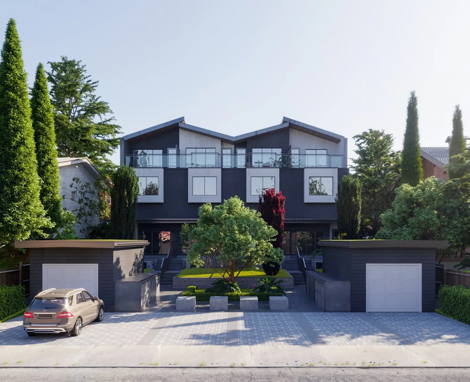 Aspen – Street-level daytime view of the modern townhouse duplex, showing dark charcoal siding, white-trimmed corner window boxes, glass balcony railings under twin gabled rooflines, and a shared central entry framed by a large tree and red-leafed shrub.