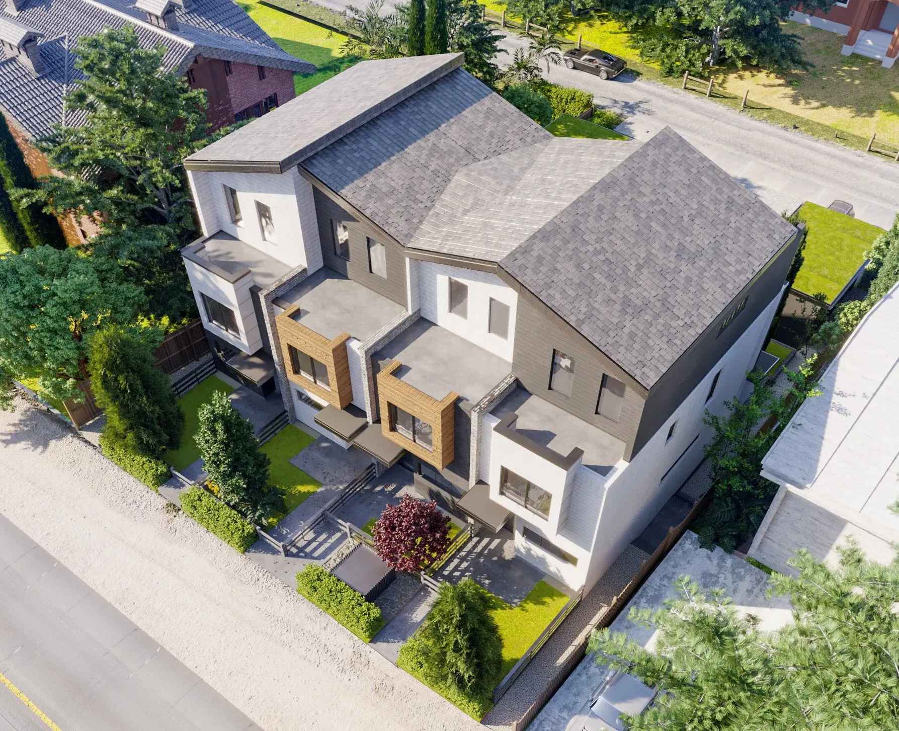 Aspen – A second aerial/drone angle of the same townhouse complex showing the full roofline, driveway, attached garages with green living roofs, and the surrounding street and neighboring properties.