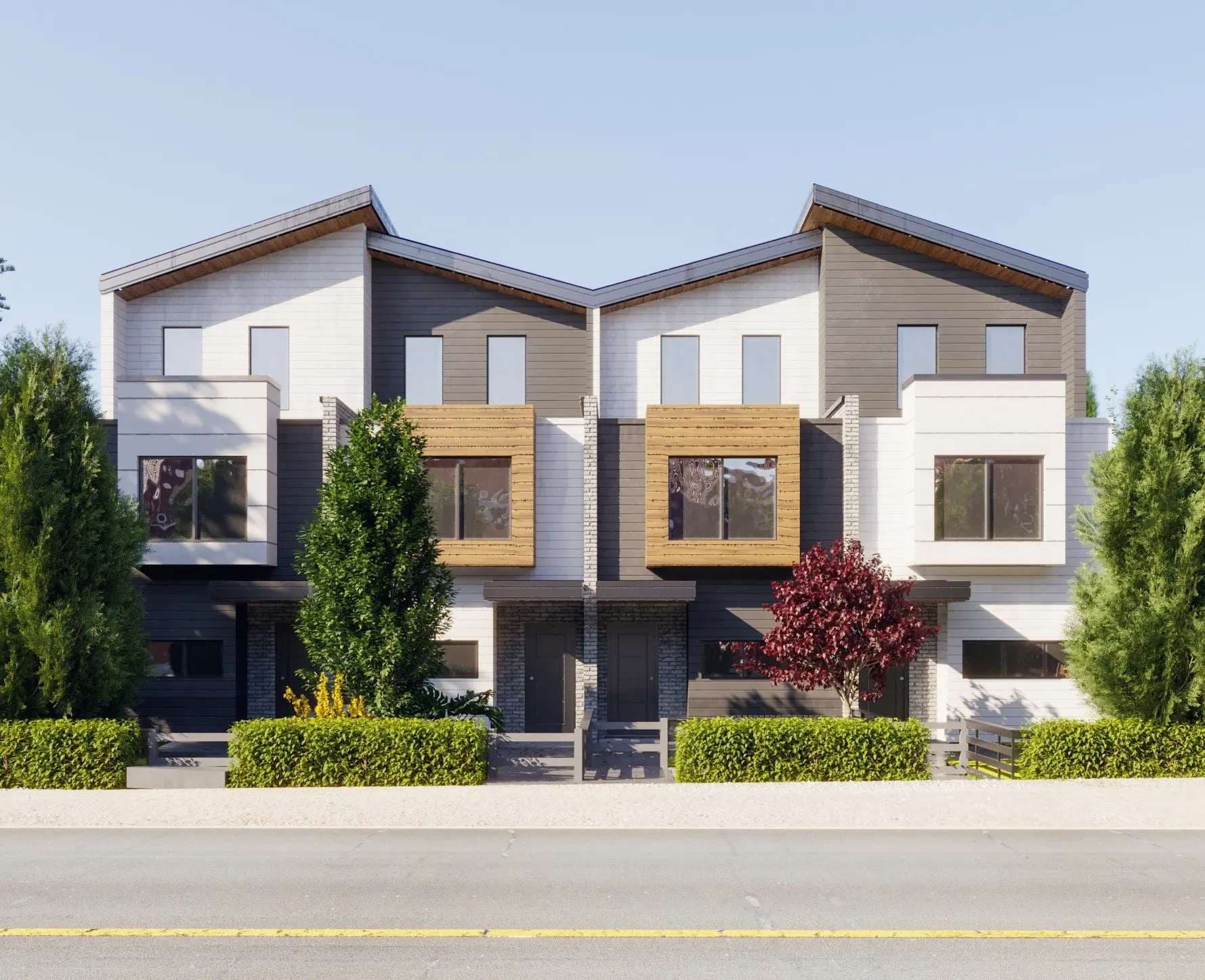 Aspen – Another street-level daytime shot of the symmetrical two-unit townhouse building, showing matching gabled peaks, wood-toned window boxes, white garage doors, and manicured hedges along the front walkway.