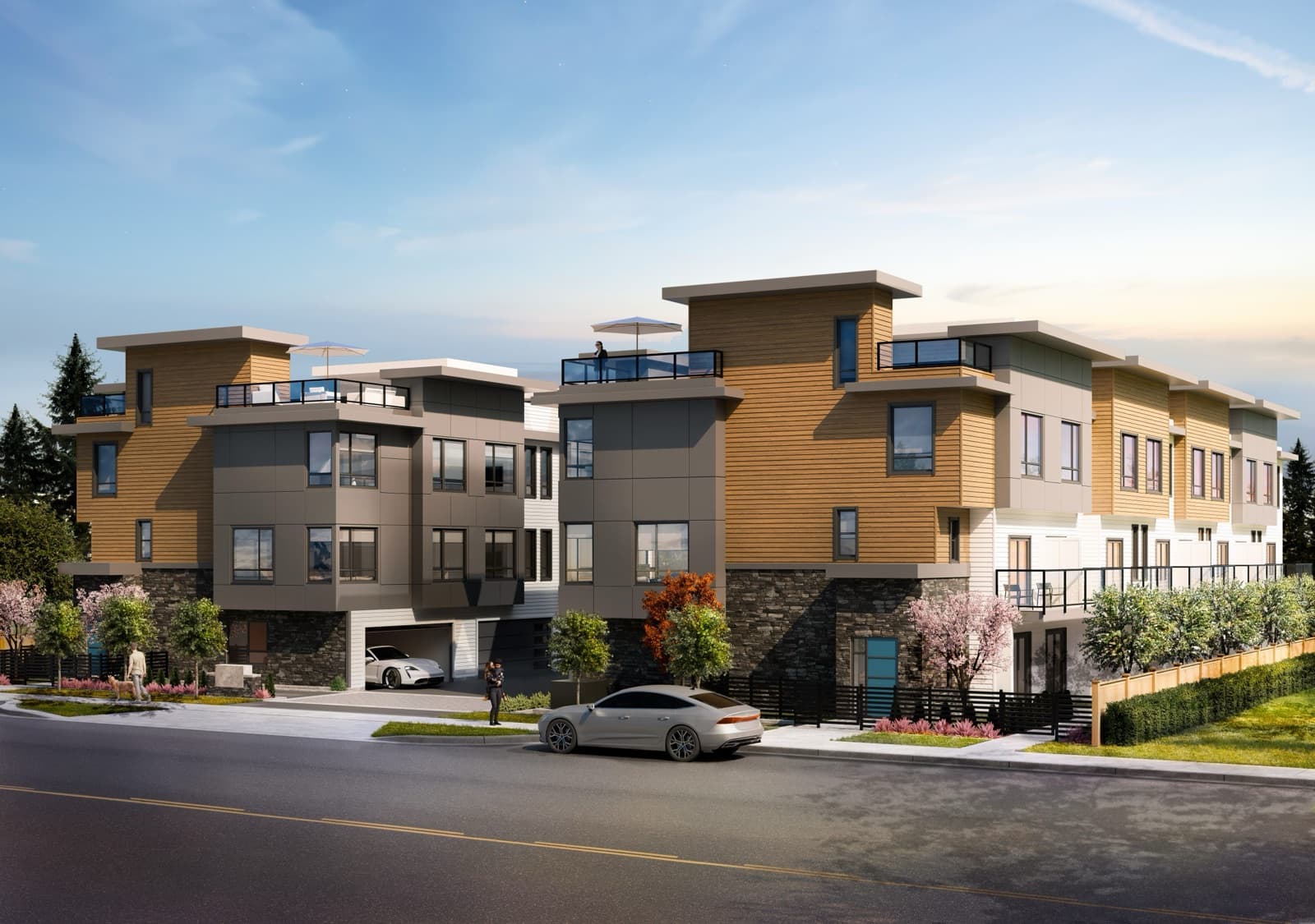 VIVID Townhomes – Street-level rendering of a modern grey, brick, and cream townhome complex with blooming cherry blossom trees, a picket fence, and a cyclist passing by.