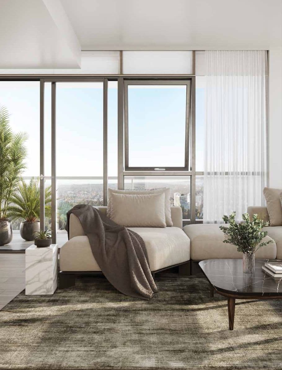 Nuvo Condos – High-floor living room rendering with a beige sectional and marble coffee table beside floor-to-ceiling windows overlooking the city.