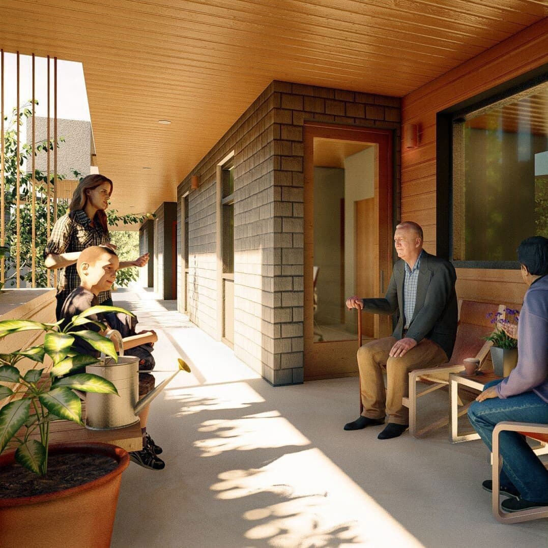 Compass Cohousing – Covered outdoor breezeway with residents of different ages sitting and chatting together on a sunny porch.