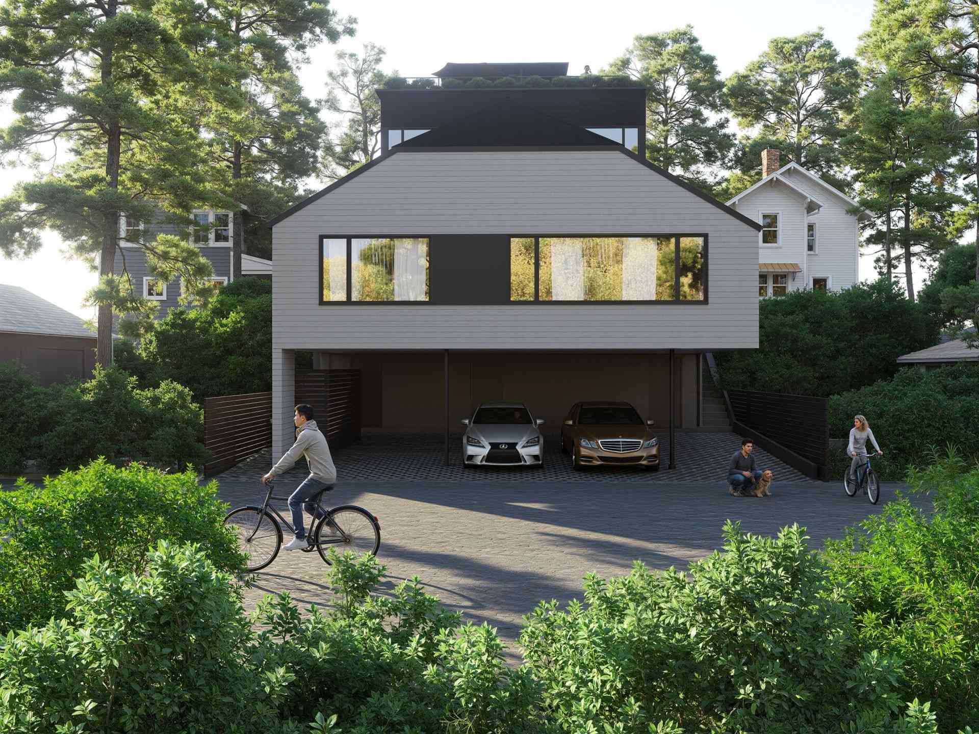 The Park Residences – An eye-level view of a contemporary home with light horizontal siding, black trim, and a rooftop deck, featuring a covered ground-level carport housing two luxury cars. In the paved driveway, people are riding bicycles and walking a dog, all framed by dense green bushes and tall pine trees under bright daylight.