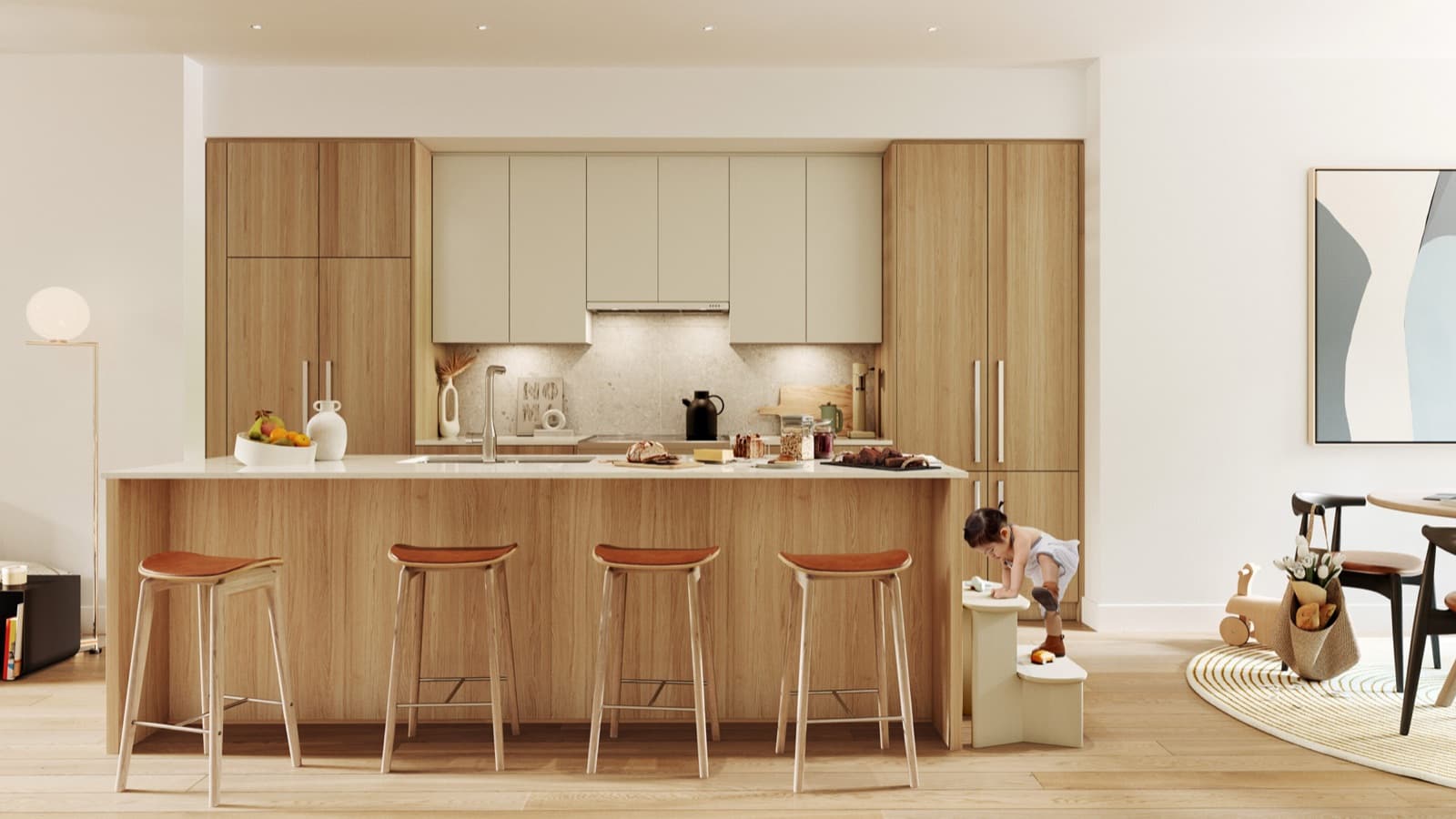 Towns at Lynn – Kitchen with a wood island, cream upper cabinets, orange bar stools, and a child climbing onto a step stool nearby.