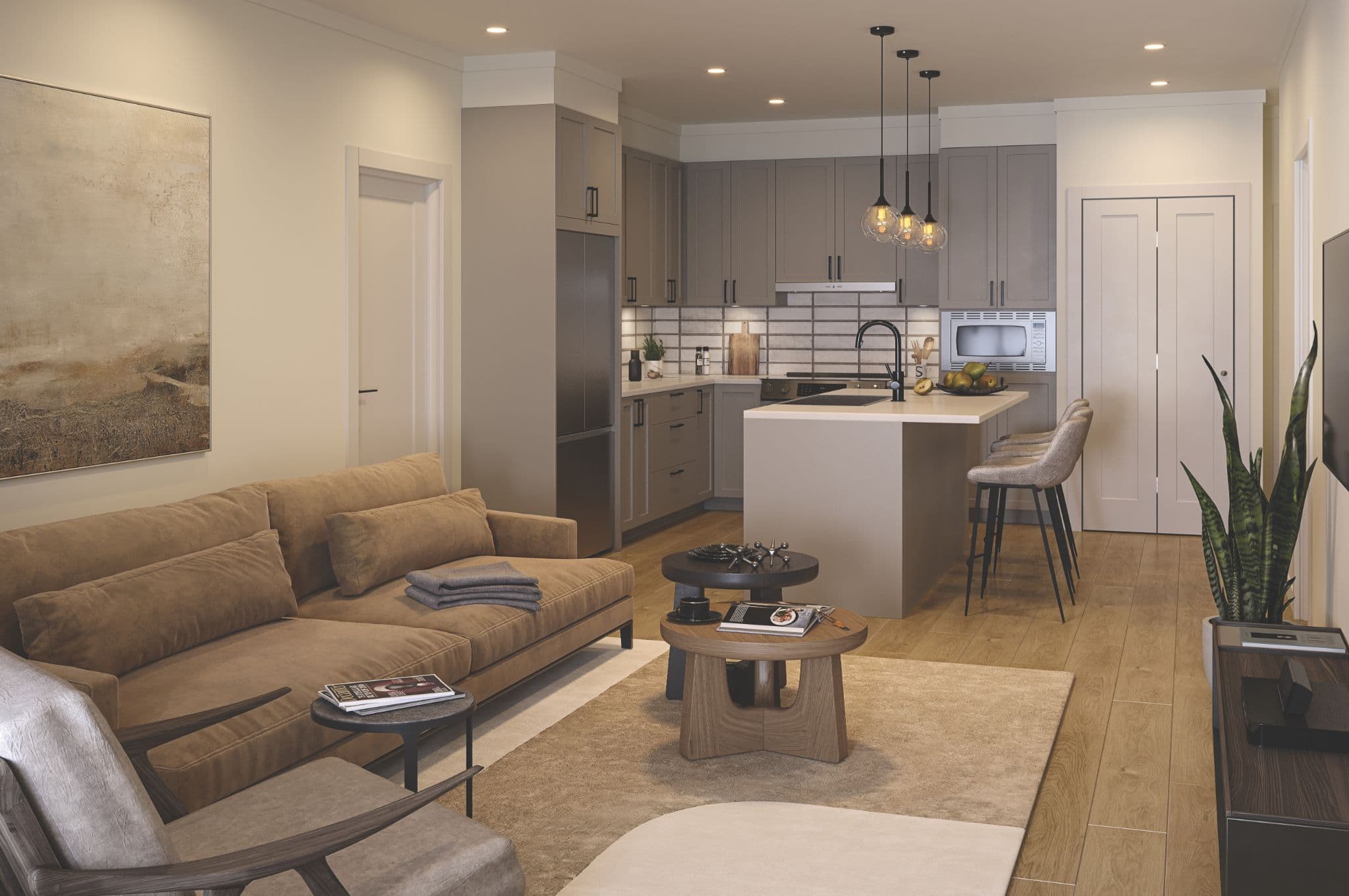 Chronicle – An open-concept living room and kitchen featuring neutral beige and grey tones with warm wood flooring throughout. The living area is furnished with a tan suede sofa, wooden coffee tables, and contemporary armchairs, while the adjacent kitchen features grey shaker cabinetry, stainless steel appliances, a white tile backsplash, and a central island with barstool seating under pendant lighting.