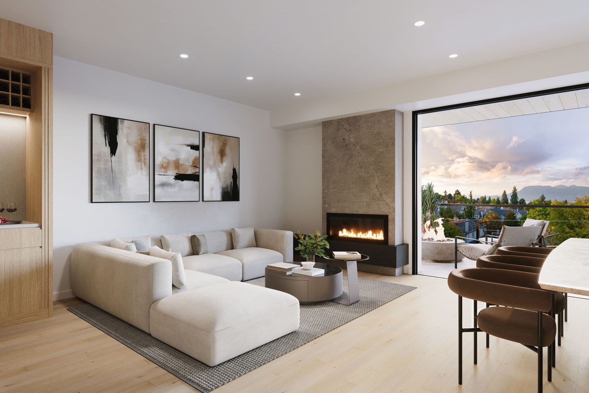 Obsidian on Tenth – An open-concept modern living room features a plush cream sectional sofa, a stone-clad fireplace with a lit fire, and light hardwood floors. Large sliding glass doors open onto a private balcony with an outdoor fire pit and sweeping views of lush greenery and distant mountains during a warm sunset.