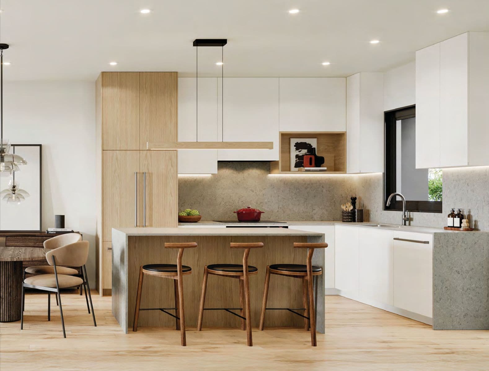 The Edgemont Collection – A white and wood kitchen with a waterfall island, pendant light fixture, bar stools, and a stone backsplash.
