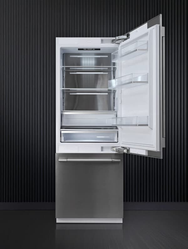 Satori – Product photo of a built-in stainless steel refrigerator with the door open showing empty shelves.