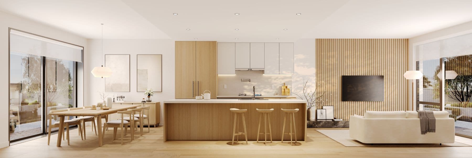 Satori – Wide view of an open-plan dining table, kitchen island with bar stools, and living room with sofa and wall-mounted TV on a wood slat accent wall.