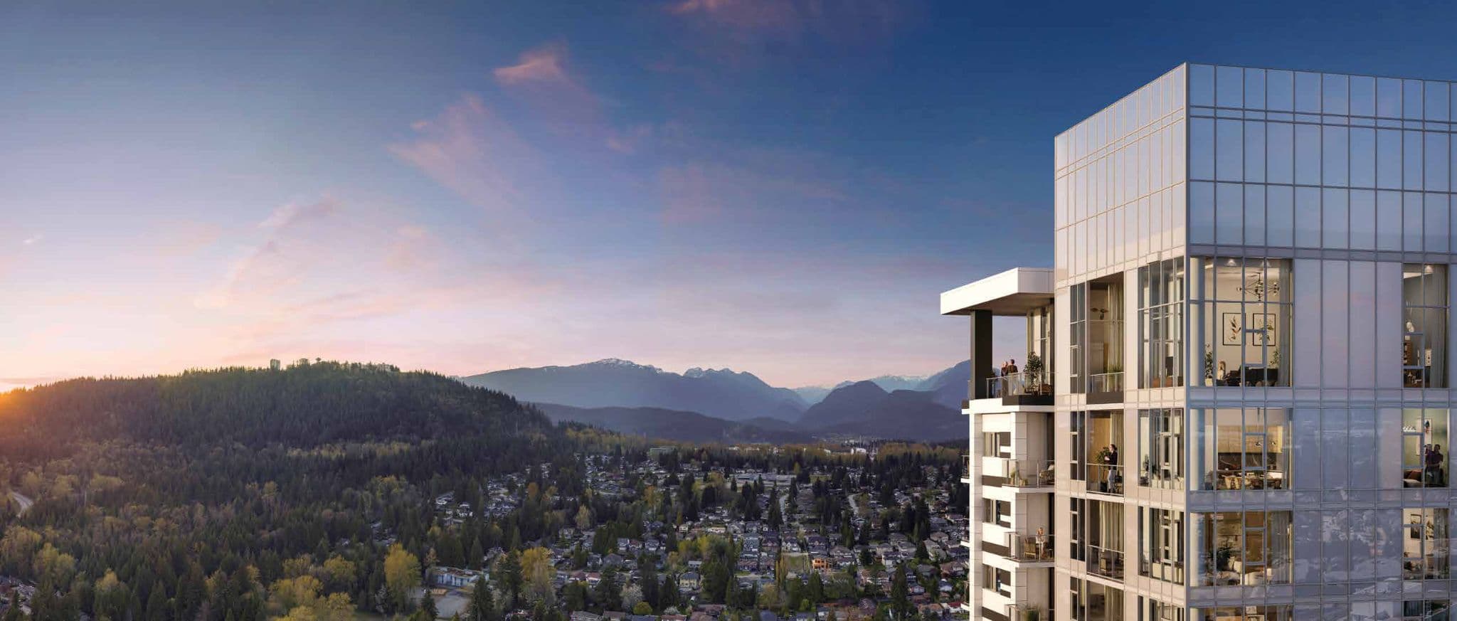 Burquitlam Park District – Close-up of a residential tower's balconies at dusk with a mountain range and forested hills in the background.